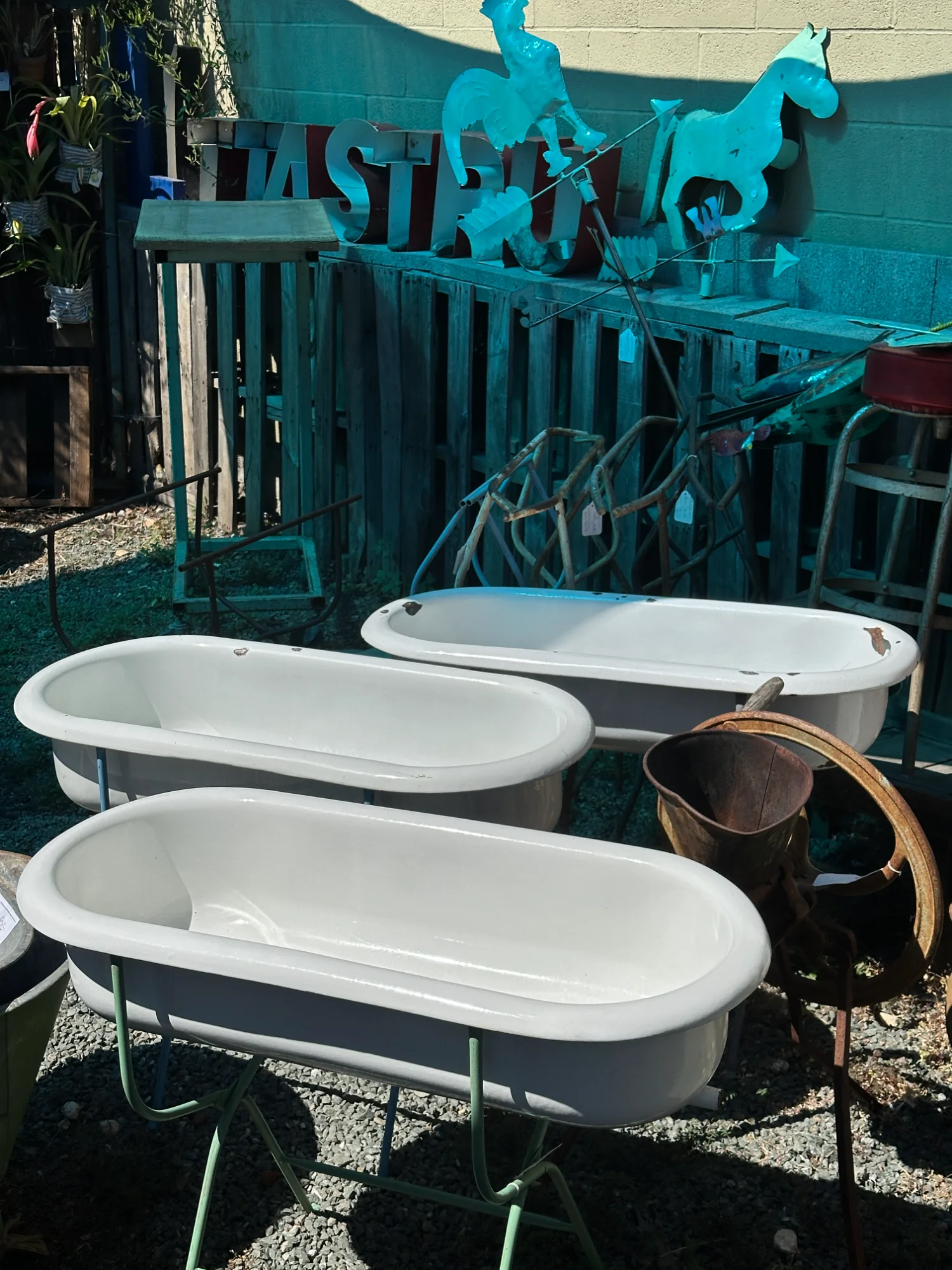 Vintage clawfoot bathtubs and outdoor antique decor